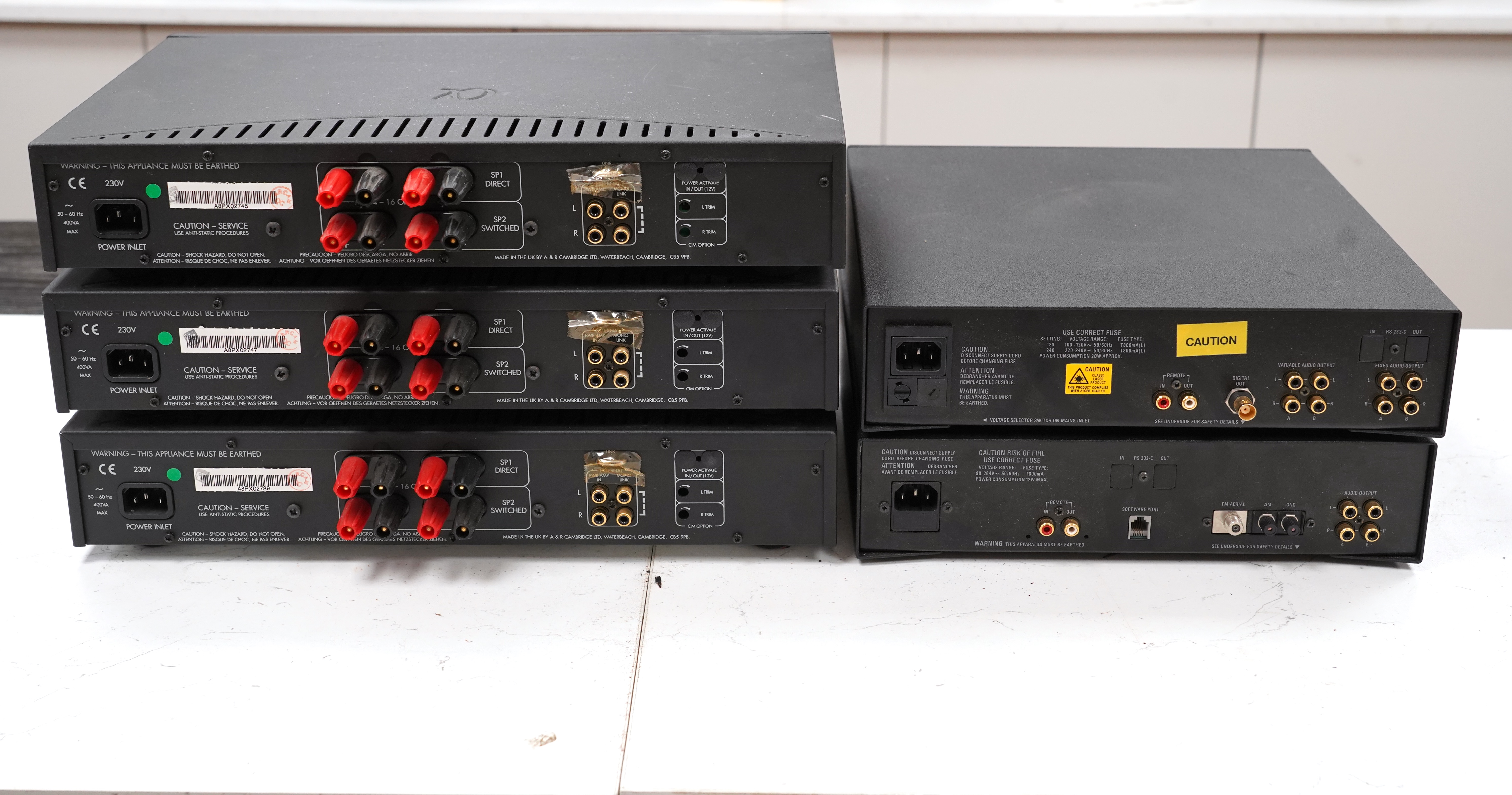 A Linn Pekin tuner, a Linn Genki CD player and three Arcam Alpha 8 Power Amps, with three remote controls, two power cables and instructions for the amplifiers